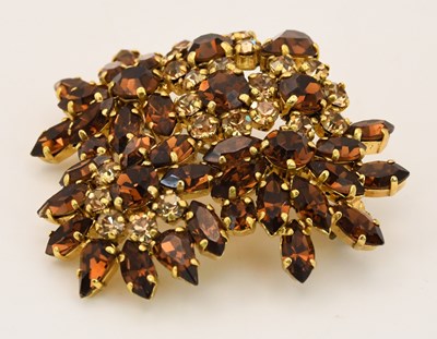 Lot 1528 - CHRISTIAN DIOR; a vintage gold plated amber...