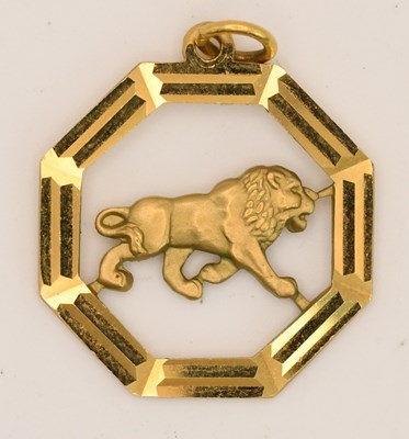 Lot 1495 - A 9ct yellow gold octagonal zodiac pendant,...
