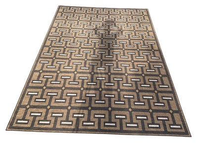 Lot 164 - RUGGABLE; a modern machine made black, beige...