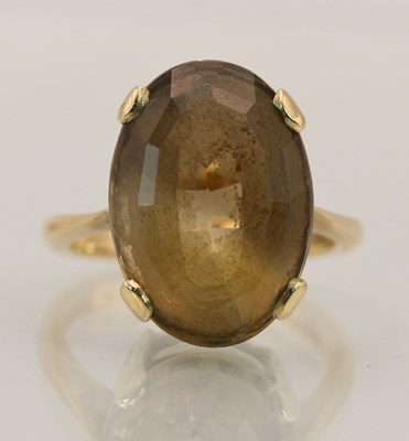 Lot 1399 - A 9ct yellow gold smoky quartz set dress ring,...