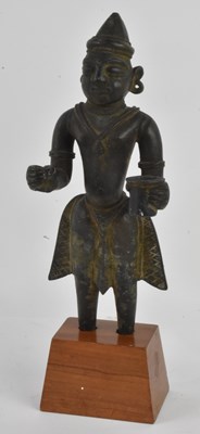 Lot 1011 - A Southeast Asian bronze standing figure,...