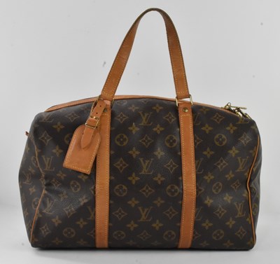 Lot 656 - LOUIS VUITTON; a vintage 'Sac Souple' brown...