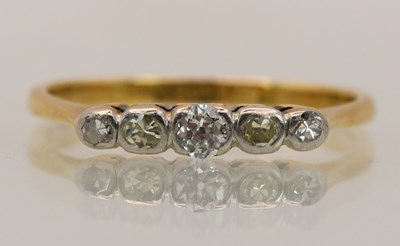 Lot 1401 - An 18ct yellow gold diamond five stone ring,...