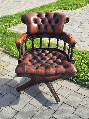 Lot 49 - A reproduction brown leather button back...