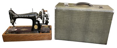 Lot 506 - A cased vintage Singer sewing machine 'EB87954'.