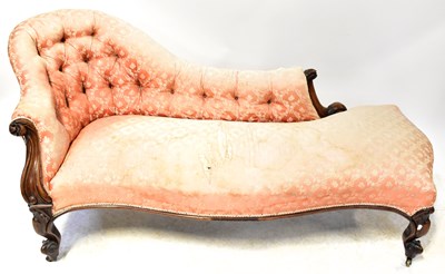 Lot 31 - A Victorian walnut chaise longue with pink...