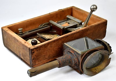 Lot 229 - A vintage cigarette rolling machine in a...