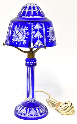 Lot 67 - A Continental overlaid blue cut glass lamp,...