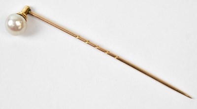 Lot 791 - A yellow metal pin set with a natural pearl in...