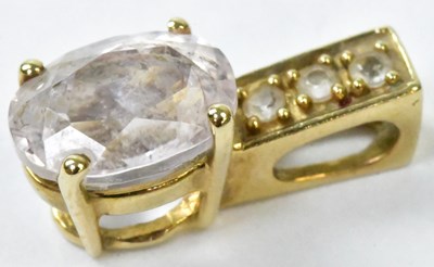 Lot 802 - A 9ct yellow gold pendant set with an oval...
