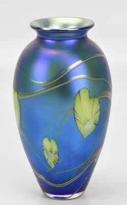 Lot 258 - OKRA; an iridescent blue glass vase, etched...