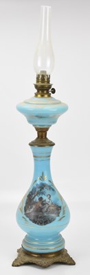 Lot 474 - A late 19th century French blue glass oil lamp,...