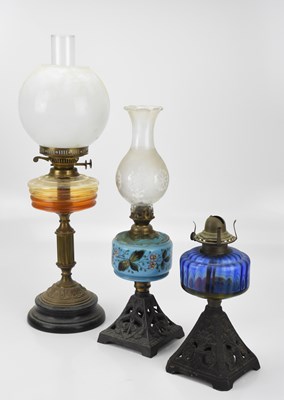Lot 475 - Three late 19th century oil lamps, including...