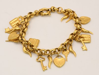 Lot 1539 - A 9ct yellow gold charm bracelet, with...