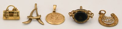 Lot 1352 - Four hallmarked 9ct yellow gold charms...