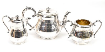 Lot 1042 - MAPPIN & WEBB; a three piece electroplated tea...