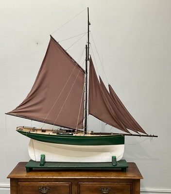 Lot 1791 - A white and green painted pond yacht, with...