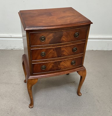 Lot 149 - A reproduction mahogany bedside chest, with...