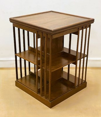Lot 650 - A mahogany revolving bookcase, missing the...