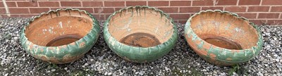 Lot 690 - A set of three semi glazed Italian terracotta...