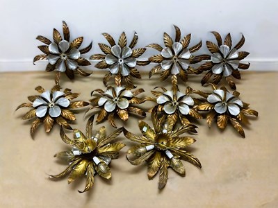 Lot 541 - A set of ten decorative beaten copper and...