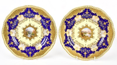 Lot 1310 - COALPORT; a pair of hand painted cabinet...