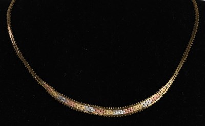 Lot 1474 - A 9ct tricolour gold semi-rigid necklace,...