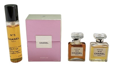 Lot 691 - CHANEL; four miniature bottles of lady's...