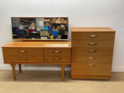 Lot 606 - AUSTIN SUITE; a teak five drawer tallboy,...