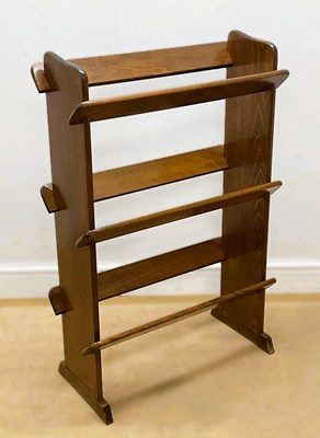 Lot 631 - A mahogany three tier freestanding book trough,...