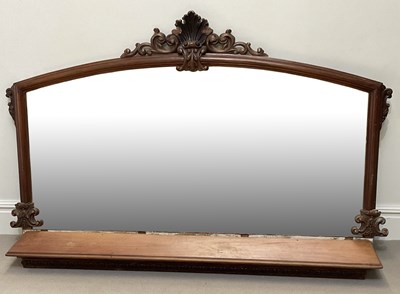 Lot 22 - A Victorian carved walnut overmantel mirror...
