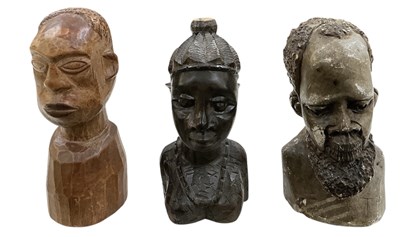 Lot 1067 - Two African tribal carved wooden portrait...