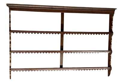 Lot 30 - An 18th century carved oak open plate rack,...