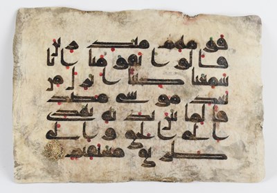 Lot 1010 - An Islamic Kufic Quran page on vellum, 16 x 23cm.