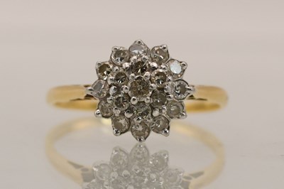 Lot 1383 - An 18ct yellow gold diamond cluster ring, size...