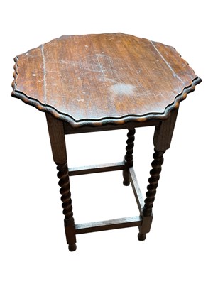 Lot 158 - A 1920s oak occasional table, with scalloped...