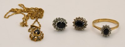 Lot 1338 - A 9ct yellow gold tiny diamond and central...