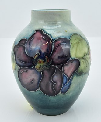 Lot 780 - MOORCROFT; a small William Moorcroft vase,...