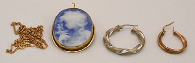Lot 1353 - A cameo of a girl in yellow gold coloured...