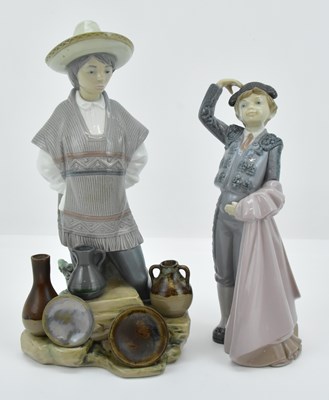 Lot 788 - LLADRÓ; two high gloss porcelain boy figures,...