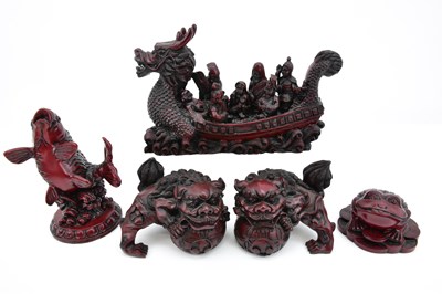 Lot 1055 - Five items of modern red lacquered animals...