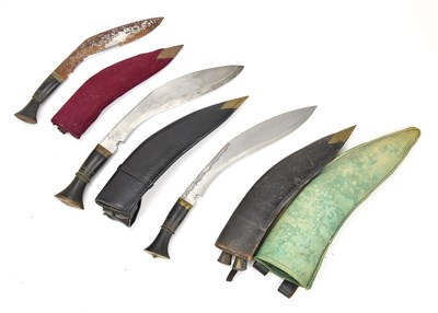 Lot 1103 - A group of three kukris, largest 39cm.