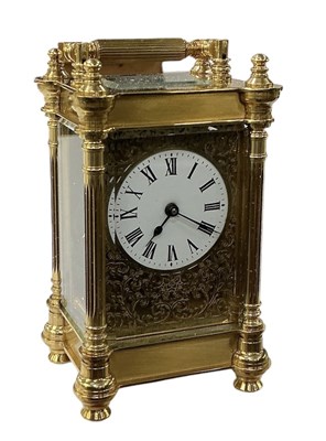 Lot 213 - A reproduction French style brass cased...