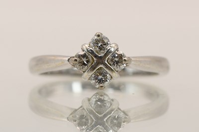 Lot 1409 - An 18ct white gold diamond cluster ring, the...