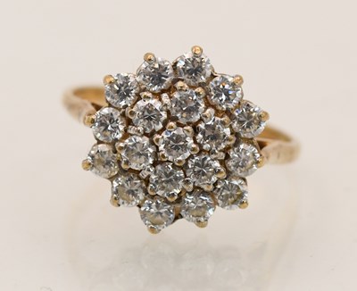 Lot 1448 - A 9ct yellow gold cluster set dress ring, with...