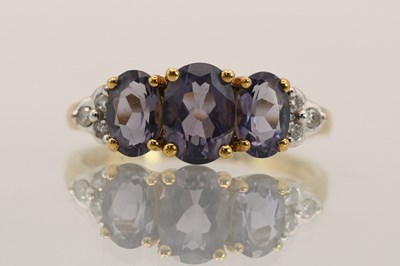 Lot 1435 - A 9ct yellow gold dress ring, with three...