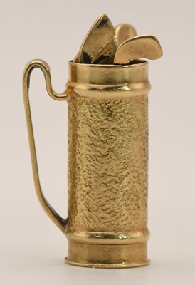 Lot 1487 - A 9ct yellow gold golf bag pendant with three...