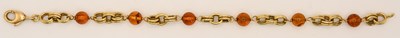 Lot 1542 - An 18ct yellow gold amber style bead and...