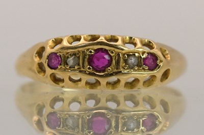 Lot 1395 - An 18ct yellow gold ruby and diamond set ring...