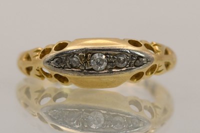 Lot 1422 - An 18ct yellow gold ring set with five...
